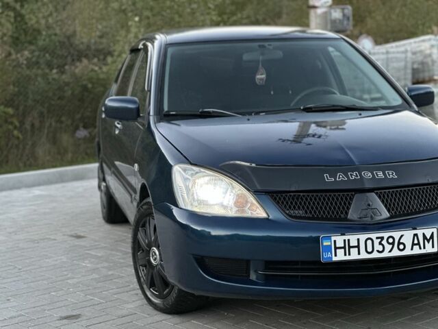 Синий Мицубиси Лансер, объемом двигателя 1.6 л и пробегом 138 тыс. км за 4800 $, фото 5 на Automoto.ua