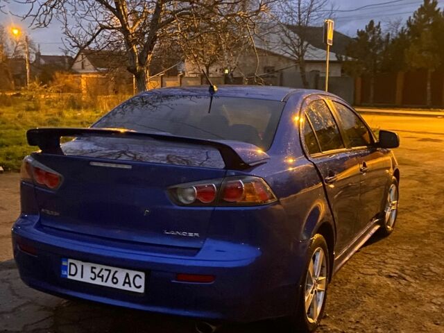 Синий Мицубиси Лансер, объемом двигателя 2 л и пробегом 176 тыс. км за 5300 $, фото 5 на Automoto.ua