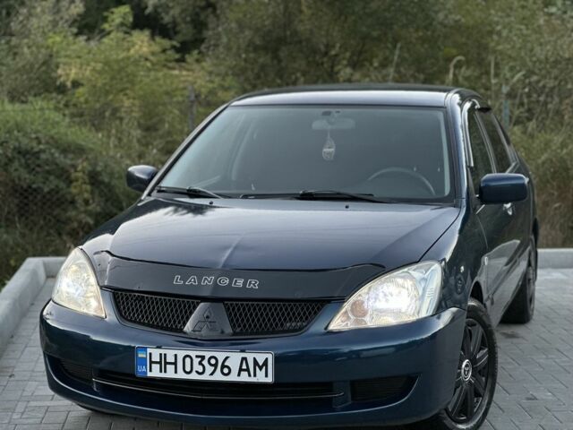 Синий Мицубиси Лансер, объемом двигателя 1.6 л и пробегом 138 тыс. км за 4800 $, фото 1 на Automoto.ua