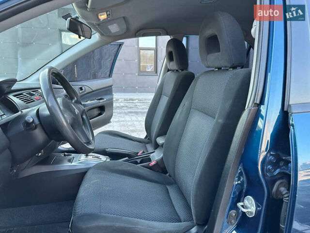 Синій Міцубісі Lancer, об'ємом двигуна 1.6 л та пробігом 250 тис. км за 5499 $, фото 11 на Automoto.ua