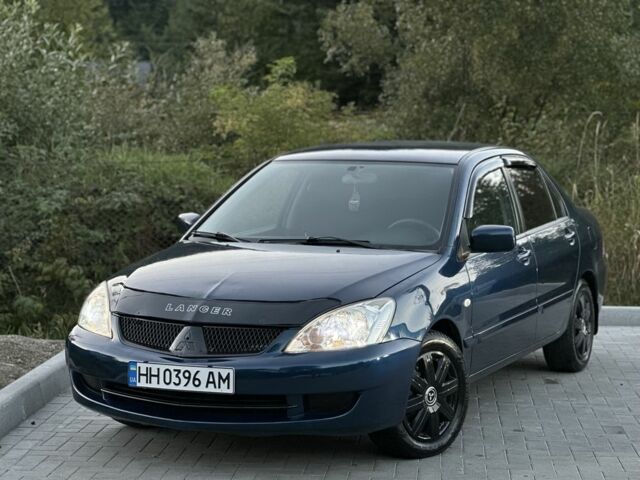 Синий Мицубиси Лансер, объемом двигателя 1.6 л и пробегом 138 тыс. км за 4800 $, фото 2 на Automoto.ua