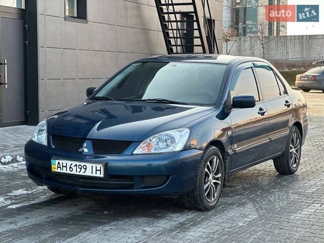 Синій Міцубісі Lancer, об'ємом двигуна 1.6 л та пробігом 250 тис. км за 5499 $, фото 3 на Automoto.ua