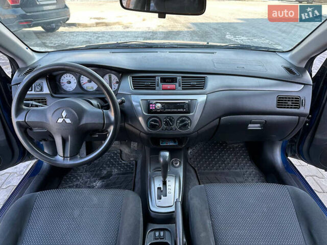 Синій Міцубісі Lancer, об'ємом двигуна 1.6 л та пробігом 250 тис. км за 5499 $, фото 12 на Automoto.ua