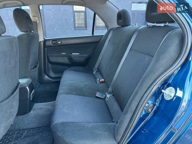Синій Міцубісі Lancer, об'ємом двигуна 1.6 л та пробігом 250 тис. км за 5499 $, фото 20 на Automoto.ua