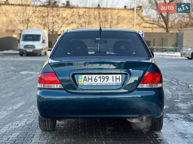 Синій Міцубісі Lancer, об'ємом двигуна 1.6 л та пробігом 250 тис. км за 5499 $, фото 7 на Automoto.ua