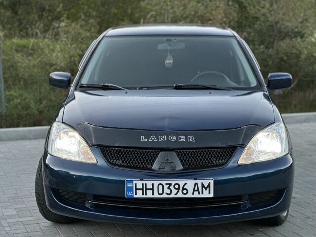 Синий Мицубиси Лансер, объемом двигателя 1.6 л и пробегом 138 тыс. км за 4800 $, фото 3 на Automoto.ua