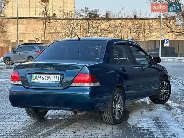 Синій Міцубісі Lancer, об'ємом двигуна 1.6 л та пробігом 250 тис. км за 5499 $, фото 8 на Automoto.ua
