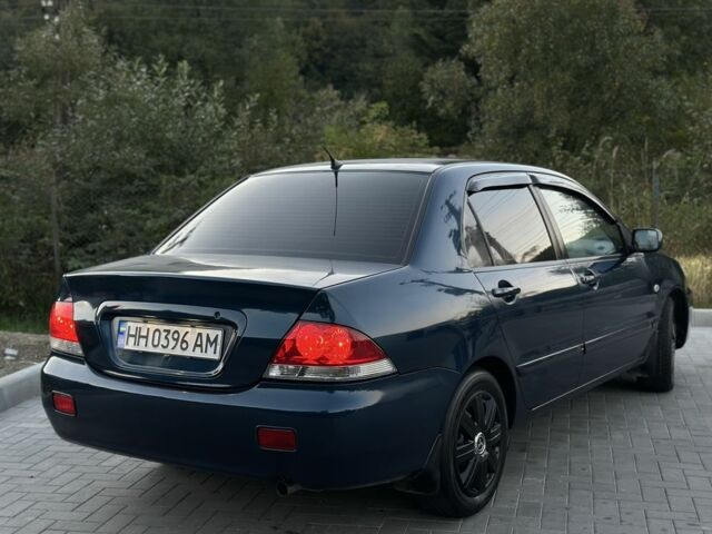 Синий Мицубиси Лансер, объемом двигателя 1.6 л и пробегом 138 тыс. км за 4800 $, фото 9 на Automoto.ua