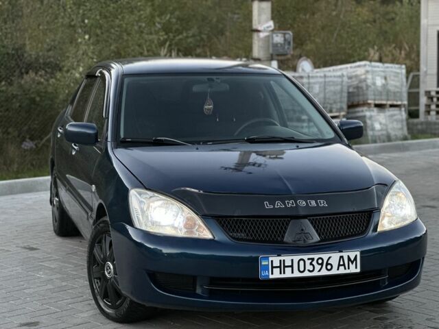 Синий Мицубиси Лансер, объемом двигателя 1.6 л и пробегом 138 тыс. км за 4800 $, фото 4 на Automoto.ua