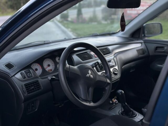 Синий Мицубиси Лансер, объемом двигателя 1.6 л и пробегом 138 тыс. км за 4800 $, фото 11 на Automoto.ua