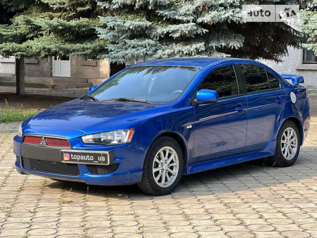 Синій Міцубісі Lancer, об'ємом двигуна 2 л та пробігом 201 тис. км за 7300 $, фото 1 на Automoto.ua