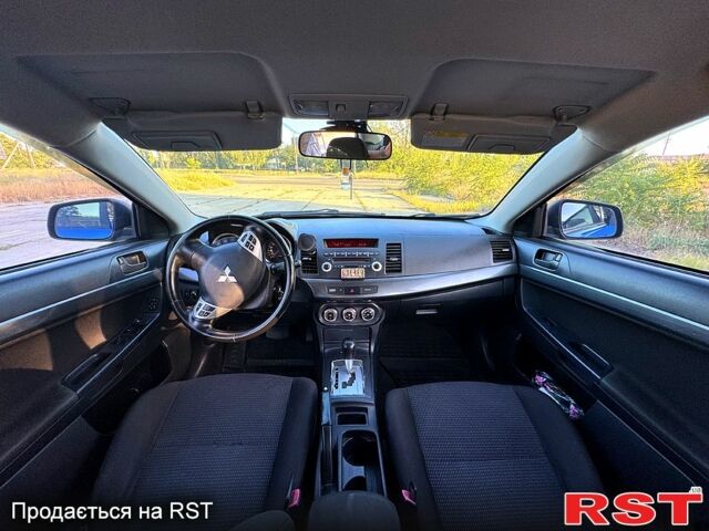 Синий Мицубиси Лансер, объемом двигателя 2 л и пробегом 261 тыс. км за 7300 $, фото 4 на Automoto.ua