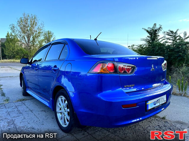 Синий Мицубиси Лансер, объемом двигателя 2 л и пробегом 240 тыс. км за 7700 $, фото 6 на Automoto.ua
