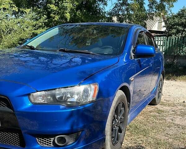 Синій Міцубісі Lancer, об'ємом двигуна 2 л та пробігом 199 тис. км за 6500 $, фото 14 на Automoto.ua