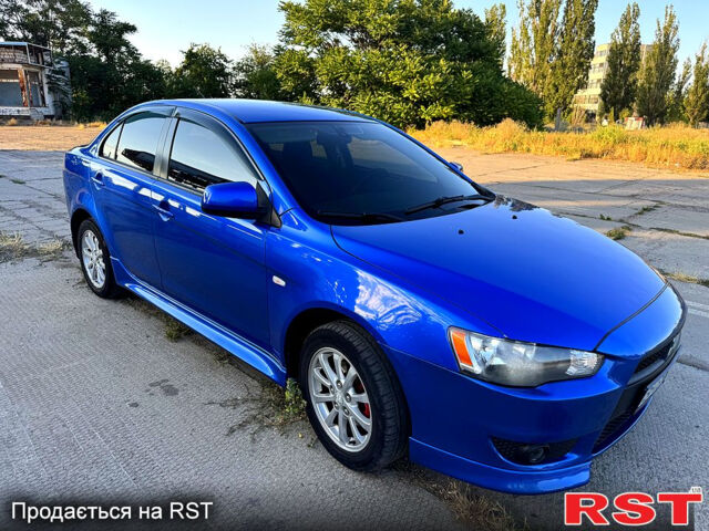 Синий Мицубиси Лансер, объемом двигателя 2 л и пробегом 240 тыс. км за 7700 $, фото 2 на Automoto.ua