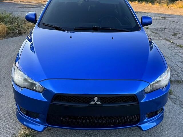 Синий Мицубиси Лансер, объемом двигателя 2 л и пробегом 261 тыс. км за 7300 $, фото 1 на Automoto.ua