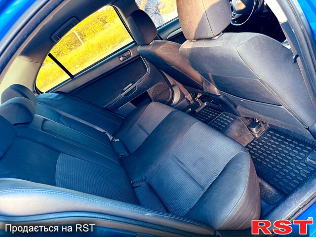 Синий Мицубиси Лансер, объемом двигателя 2 л и пробегом 240 тыс. км за 7700 $, фото 11 на Automoto.ua