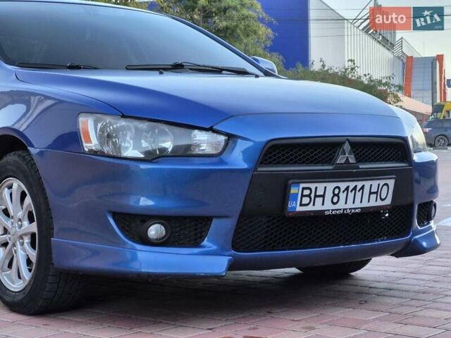 Синий Мицубиси Лансер, объемом двигателя 2 л и пробегом 250 тыс. км за 7699 $, фото 6 на Automoto.ua