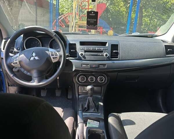 Синій Міцубісі Lancer, об'ємом двигуна 2 л та пробігом 199 тис. км за 6500 $, фото 11 на Automoto.ua