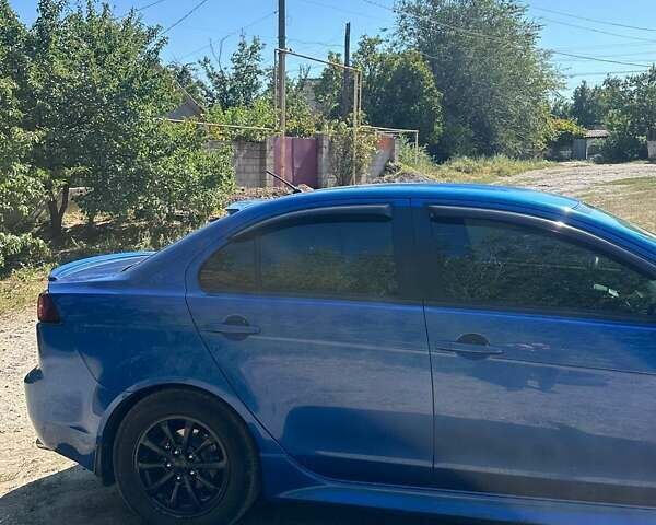 Синій Міцубісі Lancer, об'ємом двигуна 2 л та пробігом 199 тис. км за 6500 $, фото 5 на Automoto.ua