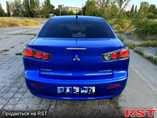 Синий Мицубиси Лансер, объемом двигателя 2 л и пробегом 261 тыс. км за 7300 $, фото 3 на Automoto.ua