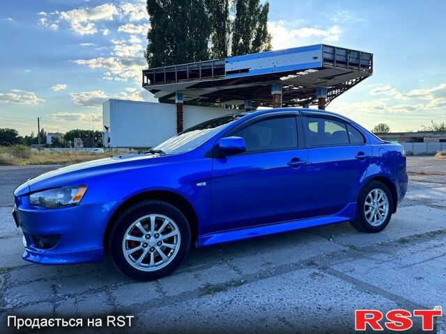 Синий Мицубиси Лансер, объемом двигателя 2 л и пробегом 261 тыс. км за 7300 $, фото 2 на Automoto.ua