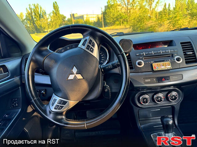 Синий Мицубиси Лансер, объемом двигателя 2 л и пробегом 240 тыс. км за 7700 $, фото 10 на Automoto.ua