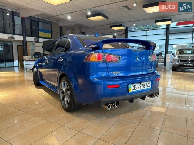 Синій Міцубісі Lancer, об'ємом двигуна 2 л та пробігом 151 тис. км за 7800 $, фото 19 на Automoto.ua