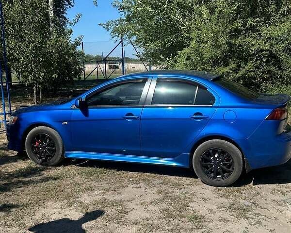 Синій Міцубісі Lancer, об'ємом двигуна 2 л та пробігом 199 тис. км за 6500 $, фото 6 на Automoto.ua