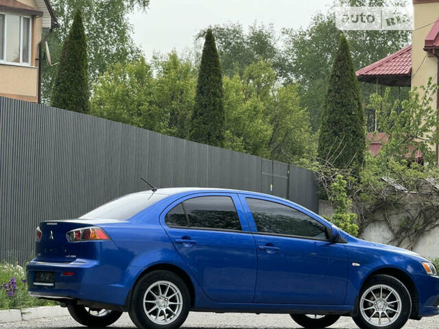 Синій Міцубісі Lancer, об'ємом двигуна 1.59 л та пробігом 150 тис. км за 7850 $, фото 21 на Automoto.ua