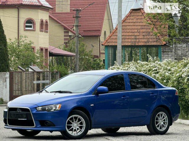 Синій Міцубісі Lancer, об'ємом двигуна 1.59 л та пробігом 150 тис. км за 7850 $, фото 11 на Automoto.ua