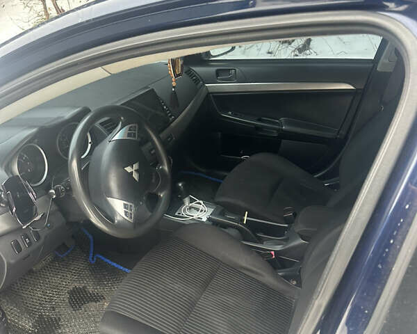 Синий Мицубиси Лансер, объемом двигателя 2 л и пробегом 168 тыс. км за 9555 $, фото 5 на Automoto.ua