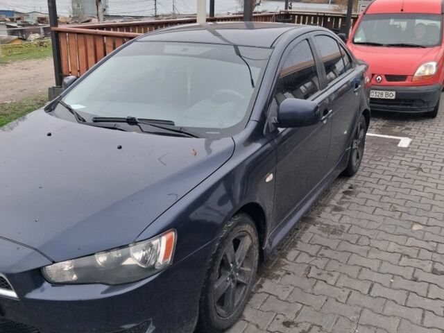 Синий Мицубиси Лансер, объемом двигателя 2 л и пробегом 233 тыс. км за 7000 $, фото 4 на Automoto.ua