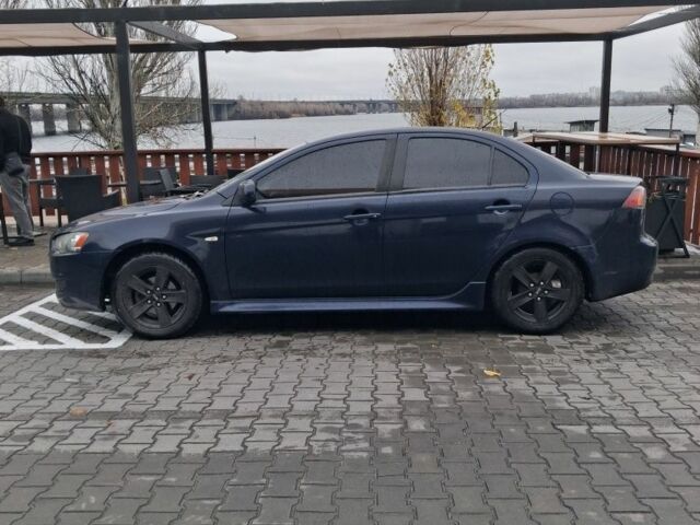 Синий Мицубиси Лансер, объемом двигателя 2 л и пробегом 233 тыс. км за 7000 $, фото 2 на Automoto.ua