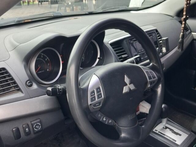 Синий Мицубиси Лансер, объемом двигателя 2 л и пробегом 233 тыс. км за 7000 $, фото 5 на Automoto.ua