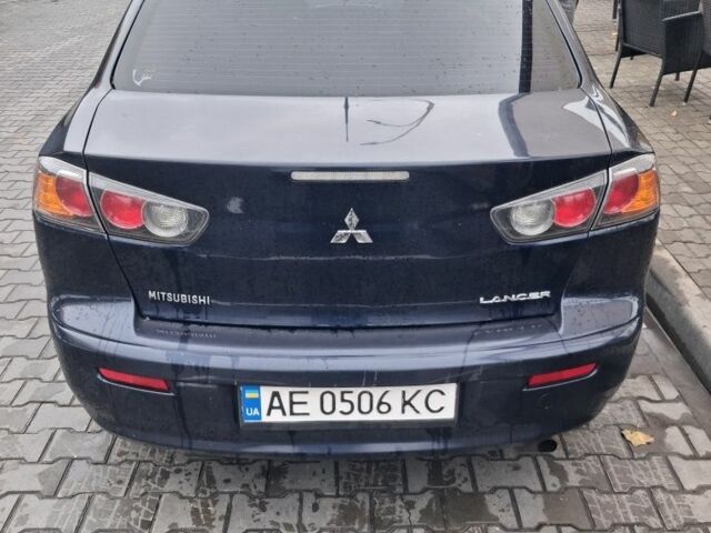 Синий Мицубиси Лансер, объемом двигателя 2 л и пробегом 233 тыс. км за 7000 $, фото 1 на Automoto.ua