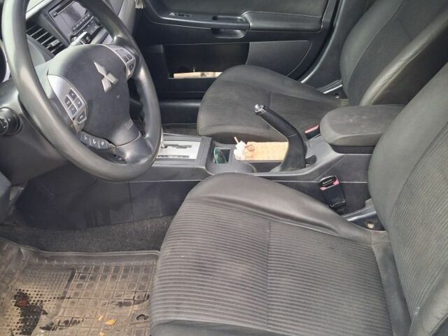 Синий Мицубиси Лансер, объемом двигателя 2 л и пробегом 233 тыс. км за 7000 $, фото 6 на Automoto.ua