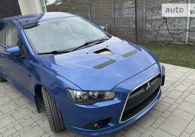 Синій Міцубісі Lancer, об'ємом двигуна 2 л та пробігом 192 тис. км за 15000 $, фото 14 на Automoto.ua