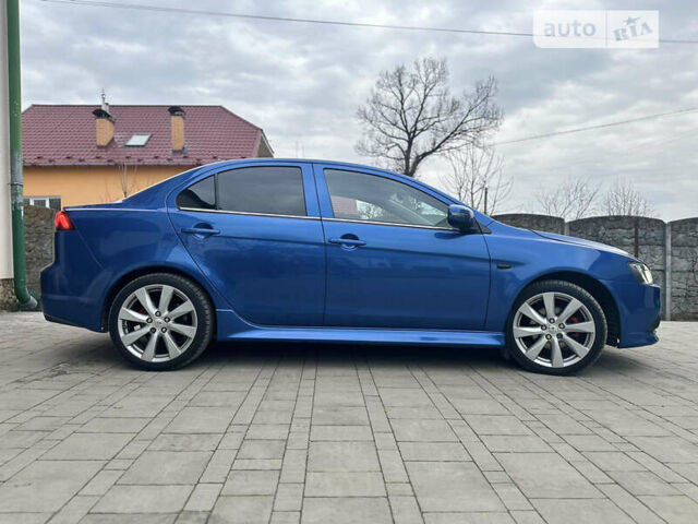 Синій Міцубісі Lancer, об'ємом двигуна 2 л та пробігом 192 тис. км за 15000 $, фото 26 на Automoto.ua