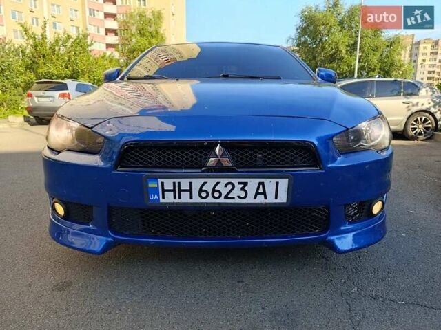 Синий Мицубиси Лансер, объемом двигателя 2 л и пробегом 115 тыс. км за 8700 $, фото 2 на Automoto.ua