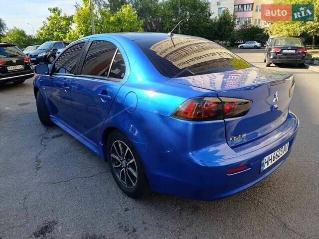 Синий Мицубиси Лансер, объемом двигателя 2 л и пробегом 115 тыс. км за 8700 $, фото 8 на Automoto.ua