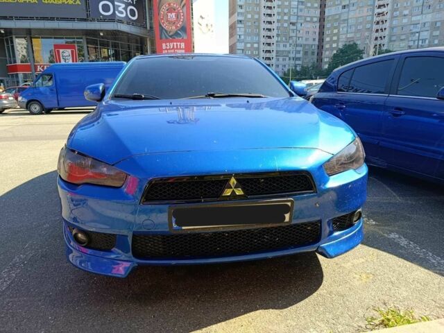 Синий Мицубиси Лансер, объемом двигателя 2 л и пробегом 130 тыс. км за 7800 $, фото 6 на Automoto.ua