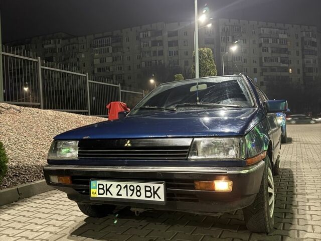 Синий Мицубиси Лансер, объемом двигателя 1.5 л и пробегом 170 тыс. км за 650 $, фото 12 на Automoto.ua