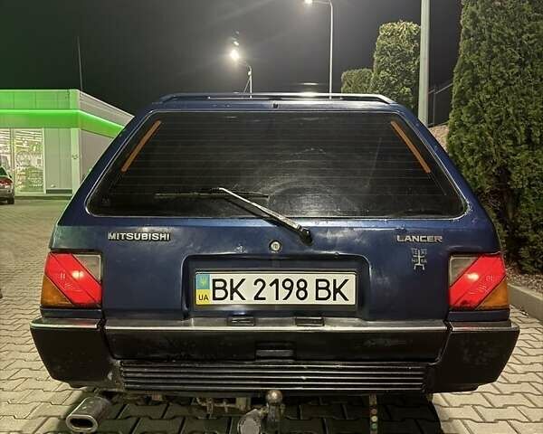 Синий Мицубиси Лансер, объемом двигателя 1.5 л и пробегом 170 тыс. км за 650 $, фото 8 на Automoto.ua