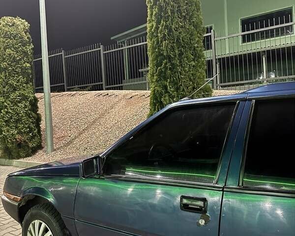 Синий Мицубиси Лансер, объемом двигателя 1.5 л и пробегом 170 тыс. км за 650 $, фото 7 на Automoto.ua