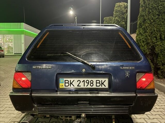 Синий Мицубиси Лансер, объемом двигателя 1.5 л и пробегом 170 тыс. км за 650 $, фото 9 на Automoto.ua
