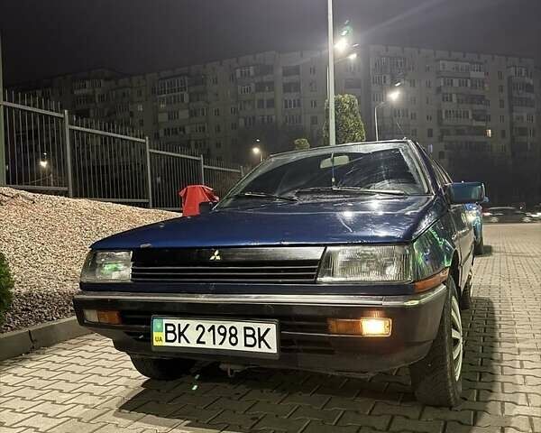 Синий Мицубиси Лансер, объемом двигателя 1.5 л и пробегом 170 тыс. км за 650 $, фото 12 на Automoto.ua