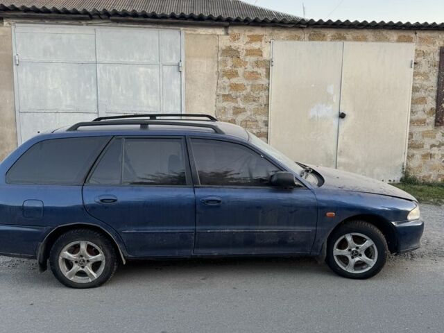 Синий Мицубиси Лансер, объемом двигателя 1.6 л и пробегом 999 тыс. км за 594 $, фото 11 на Automoto.ua