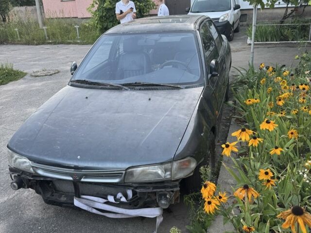 Синий Мицубиси Лансер, объемом двигателя 1.6 л и пробегом 999 тыс. км за 594 $, фото 1 на Automoto.ua