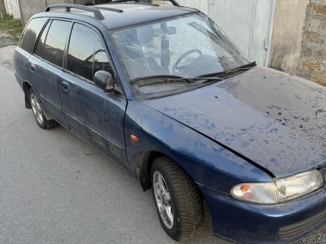 Синий Мицубиси Лансер, объемом двигателя 1.6 л и пробегом 999 тыс. км за 594 $, фото 10 на Automoto.ua